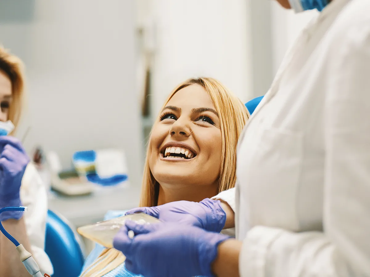 woman smiling in dentist chair